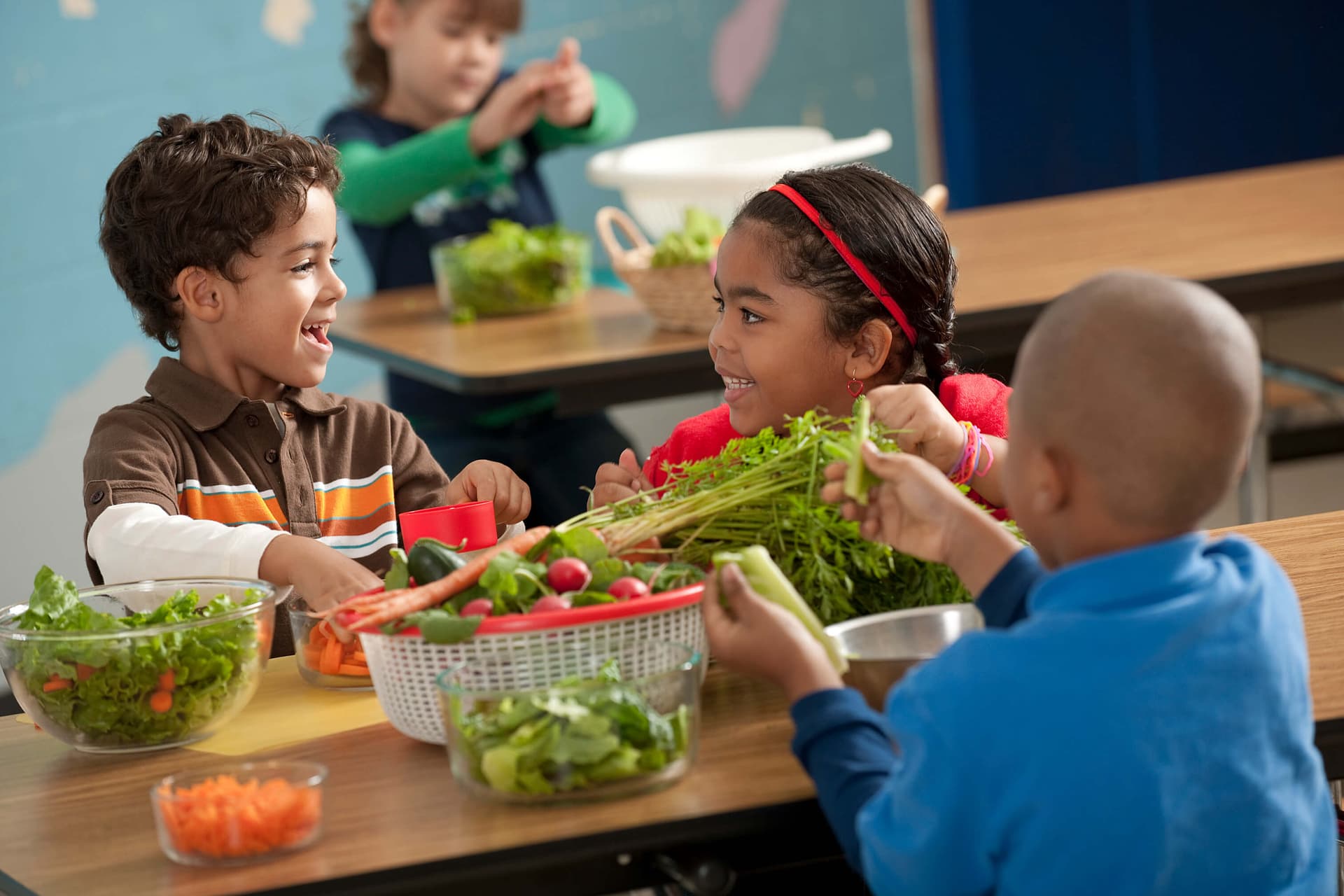 Children happily learning about fresh vegetables